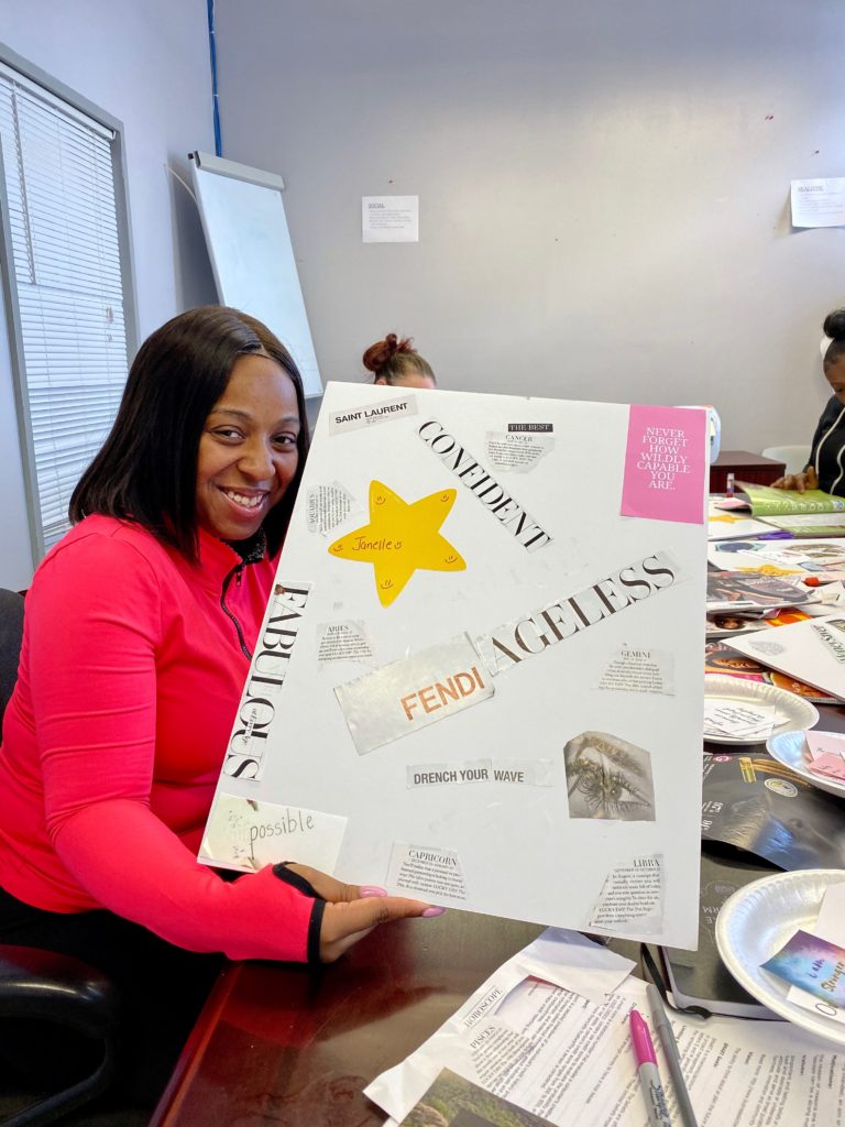 Client showing off Vision Board